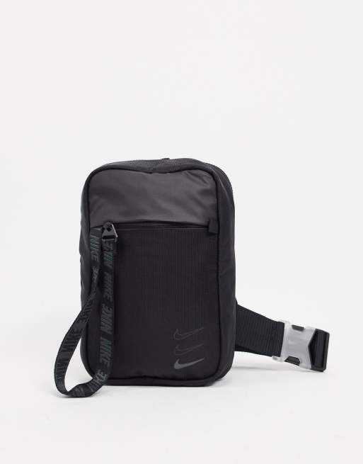 Nike essential cross body bag in black with front zip puller