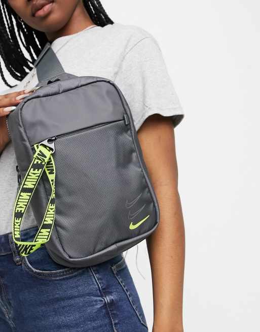 Nike essential cross body bag in grey and neon yellow with front zip ...