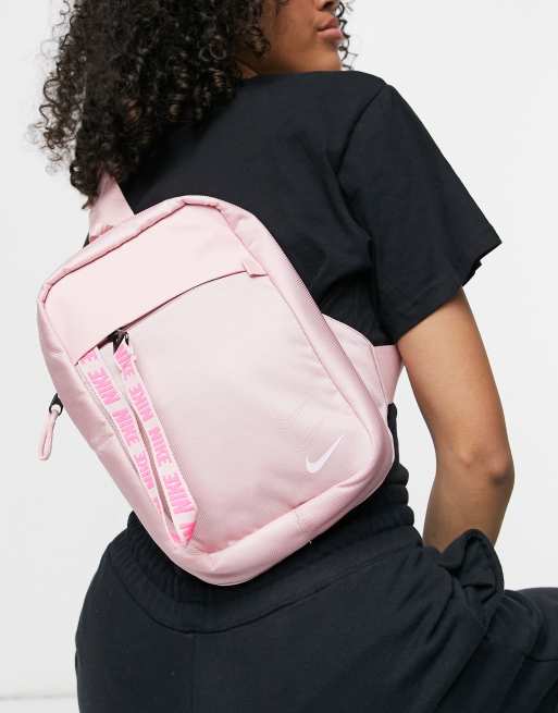 Nike essential cross body bag in pink with front zip puller