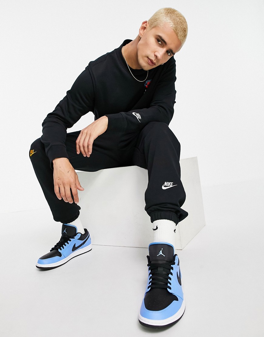 Nike Essential fleece+ multi logo casual fit cuffed joggers in black