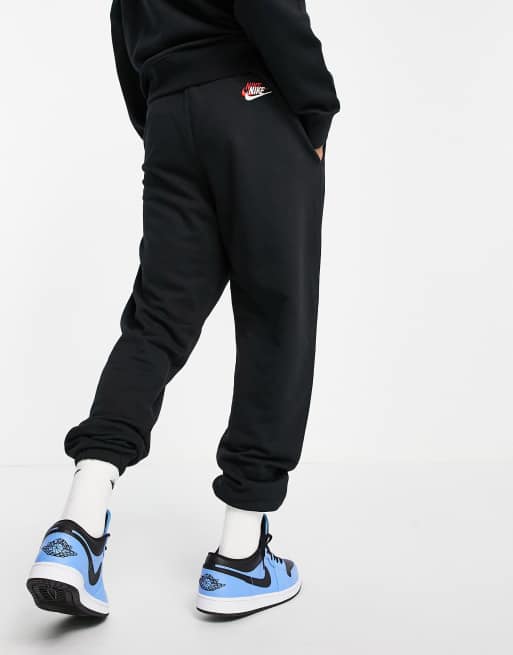 Nike Essential fleece+ multi logo casual fit cuffed joggers in black