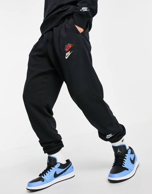 Nike Essential fleece multi logo casual fit cuffed joggers in