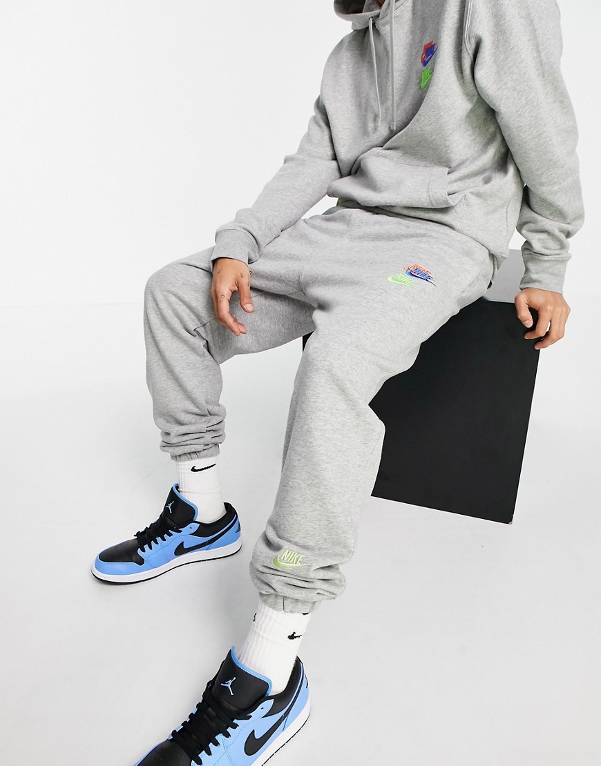 Nike Essential fleece+ multi logo casual fit cuffed joggers in grey