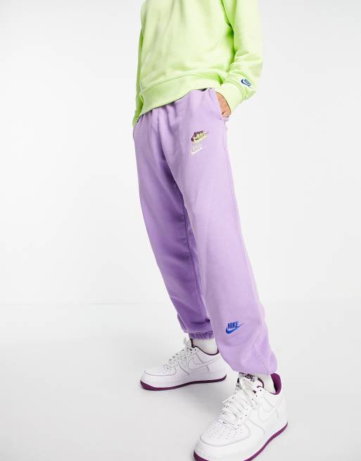 Nike Essential fleece multi logo casual fit cuffed joggers in