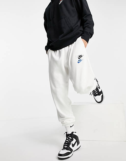 Nike Essential fleece+ multi logo casual fit cuffed joggers in white