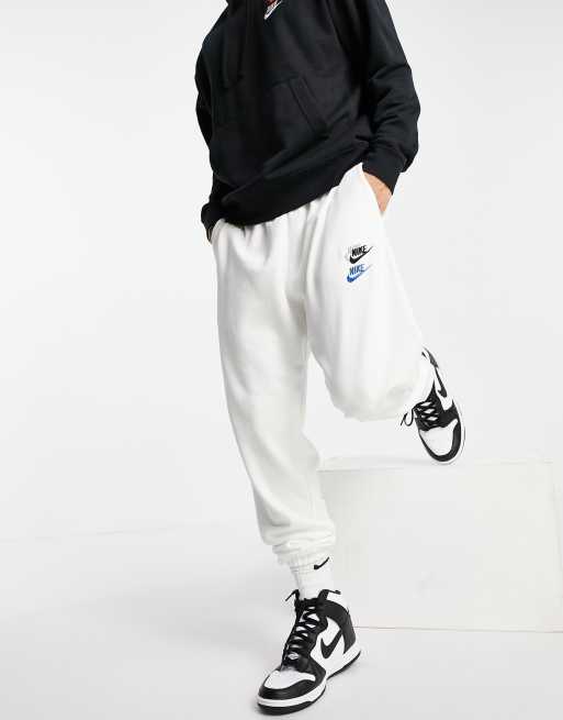 Nike Essential fleece multi logo casual fit cuffed joggers in