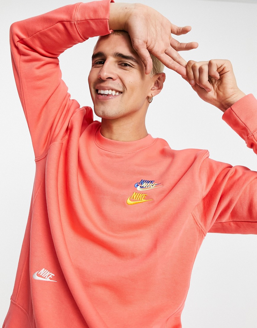 Nike Essential fleece+ multi logo crew neck sweatshirt in coral-Orange
