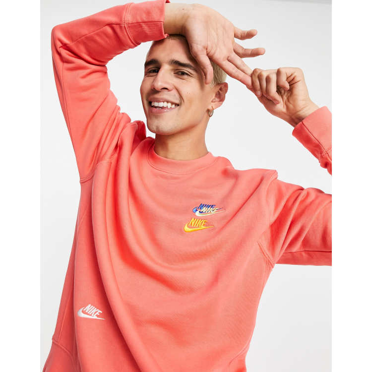 Nike Essential fleece multi logo crew neck sweatshirt in coral
