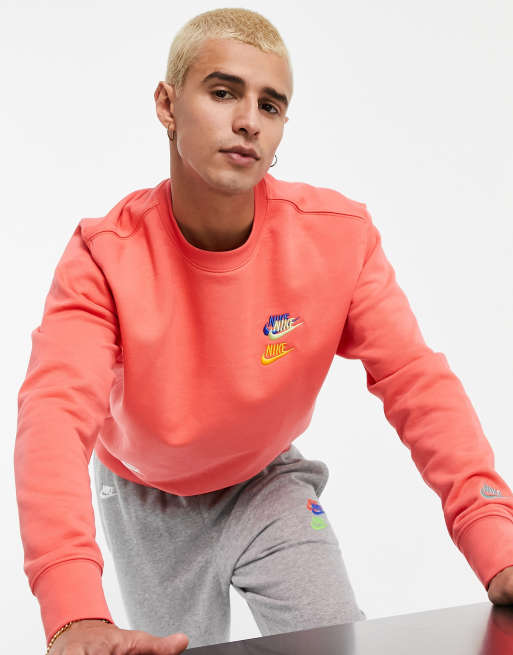 Nike Essential fleece multi logo crew neck sweatshirt in coral