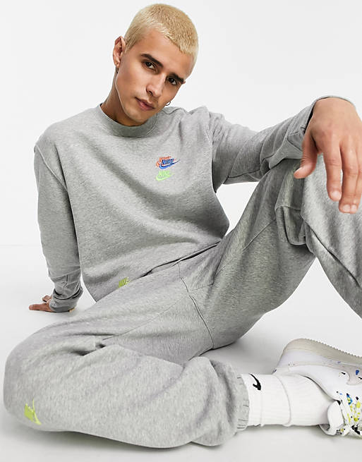 Nike Essential fleece multi logo crew neck sweatshirt in grey