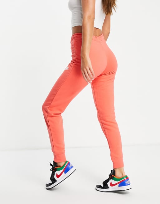 Nike essential fleece tight fit joggers in coral pink