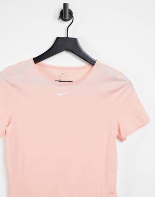 peach color nike shirt