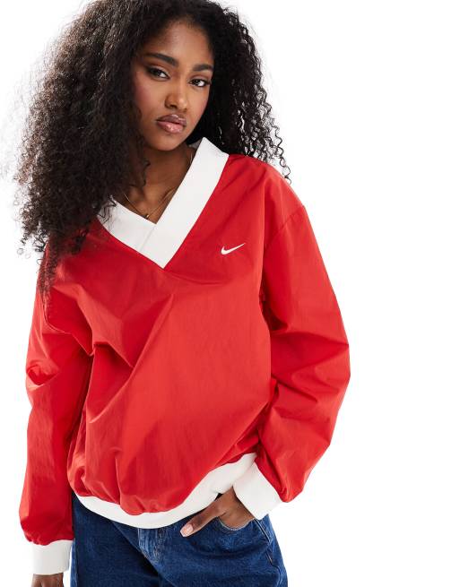 Nike Essential woven v-neck sweatshirt in red
