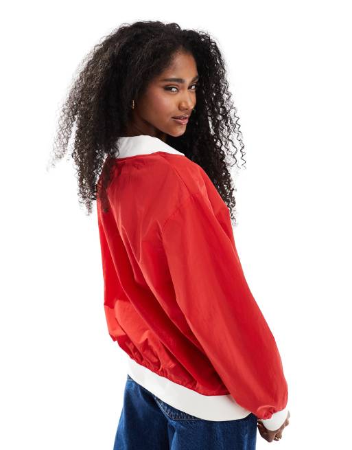 Nike Essential woven v-neck sweatshirt in red