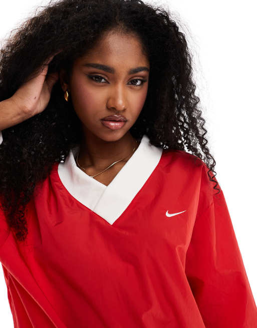 Nike Essential woven v-neck sweatshirt in red