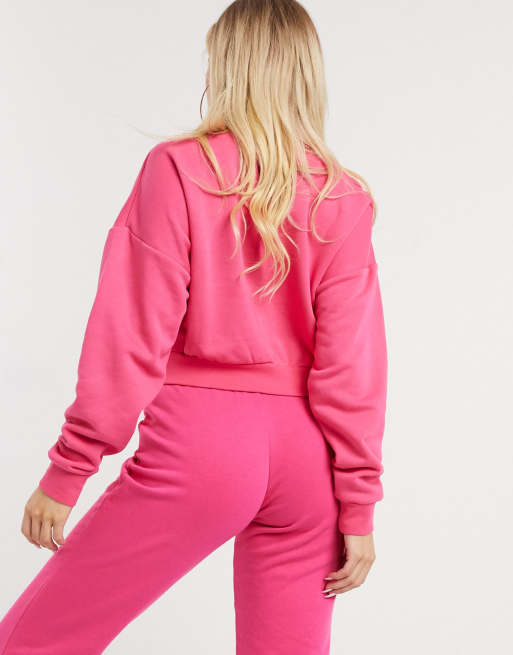 Nike Essentials pink cropped high neck sweatshirt