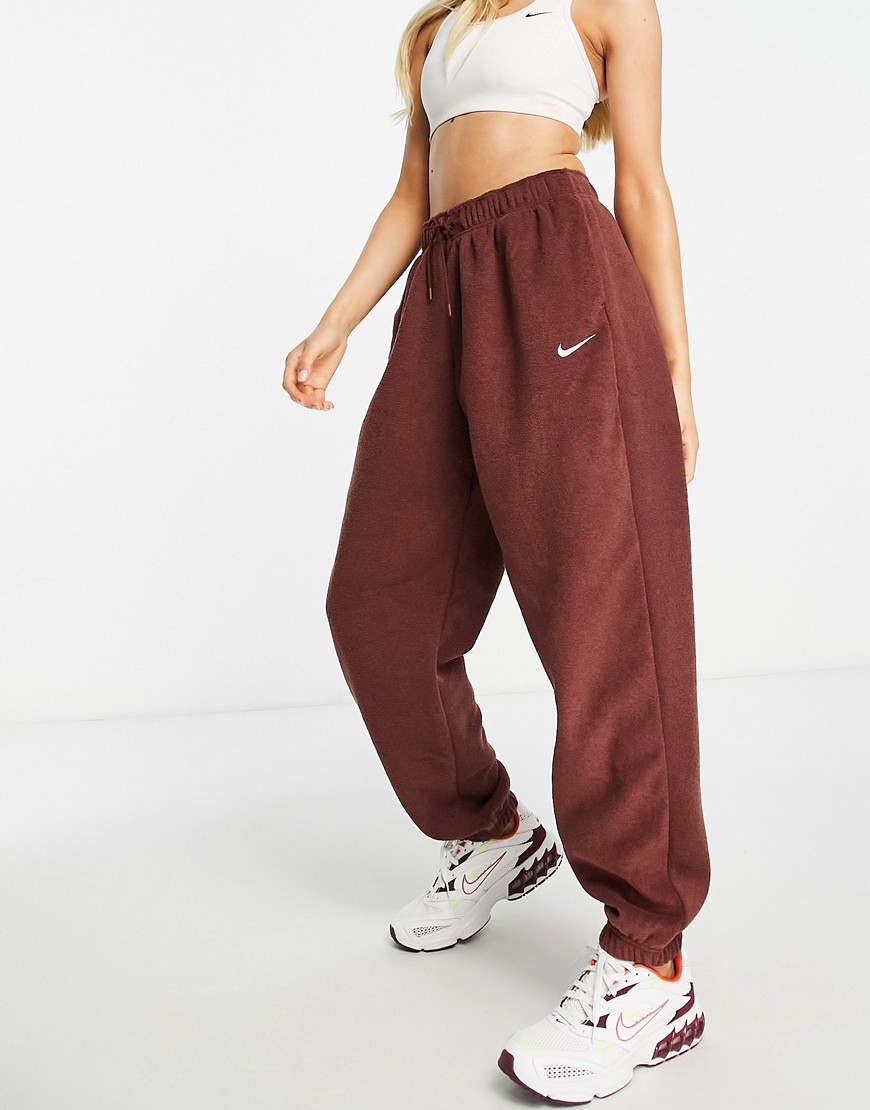 Nike Essentials Plush high-rise cuffed fleece sweatpants in bronze-Brown