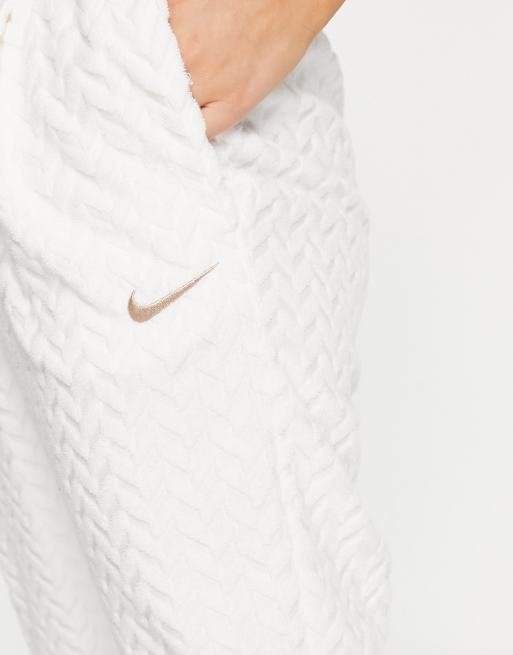 Nike nsw best sale jacquard track pants