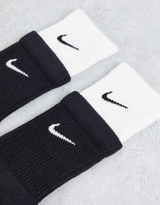 White nike socks hot sale with black swoosh