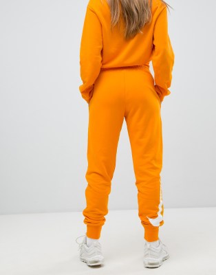 orange tracksuit nike