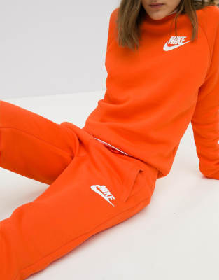 orange nike jogging pants