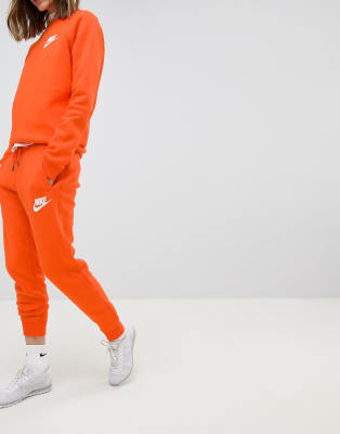 orange nike joggers womens