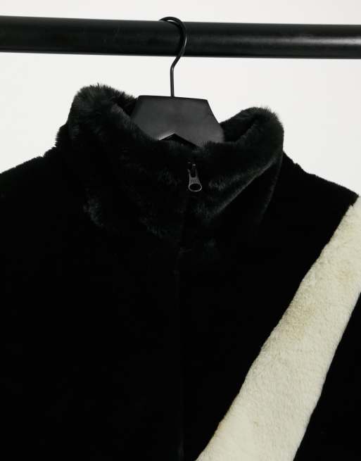 Nike faux fur oversized swoosh jacket in black ASOS