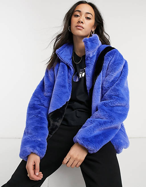 Nike faux fur oversized swoosh jacket in blue | ASOS