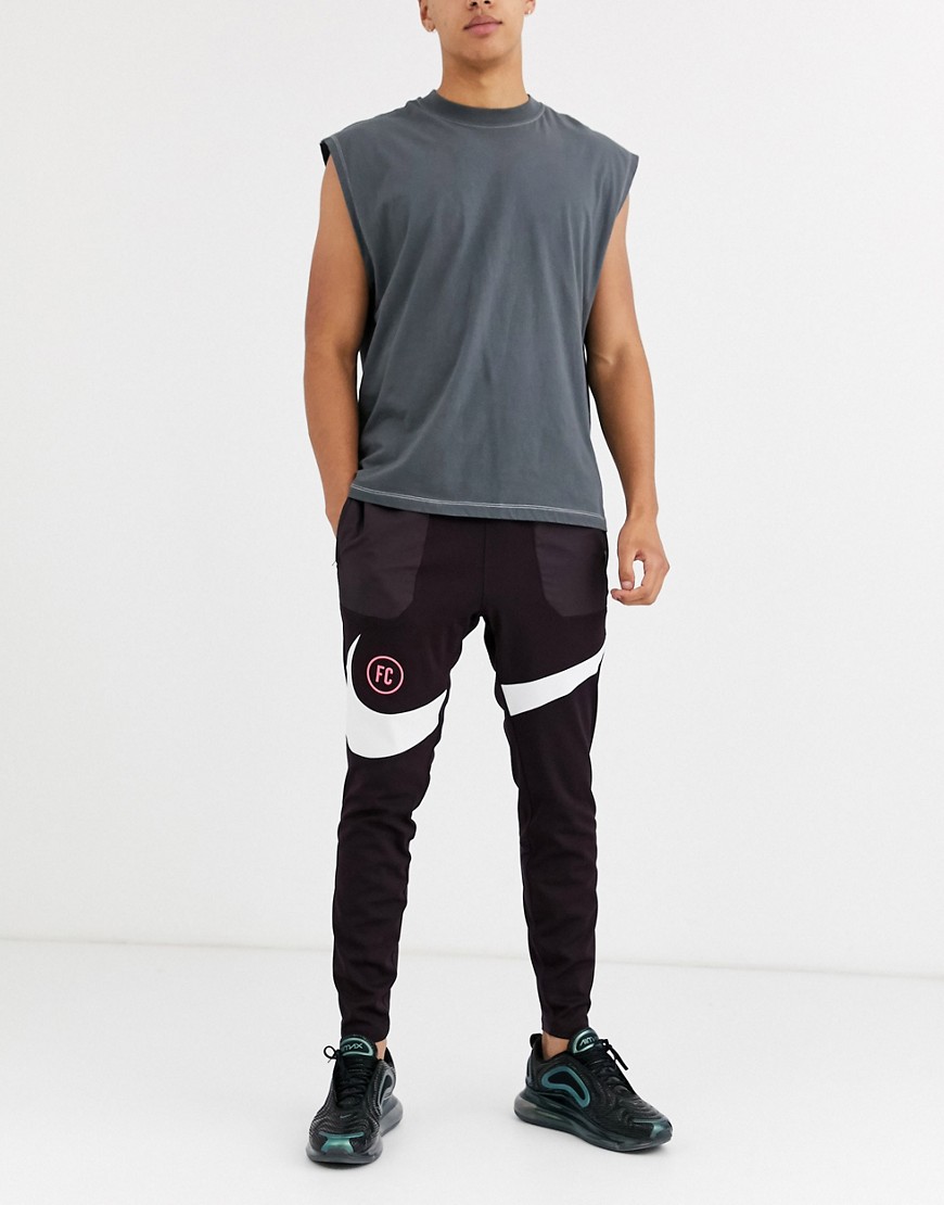 Nike - F.C. - Joggers con logo bordeaux-Rosso