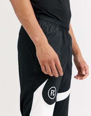 Nike F.C. swoosh sweatpants in black | ASOS