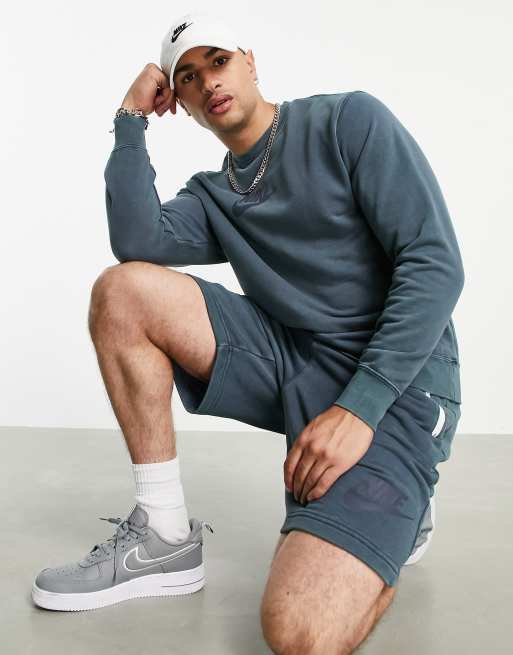 Nike - Felpa slavata blu con logo ricamato