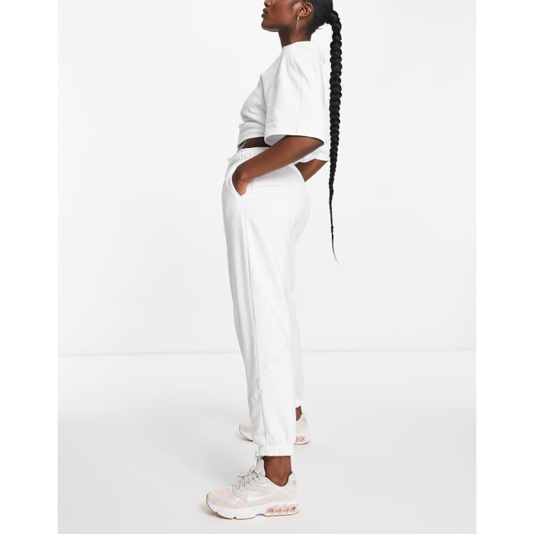 Nike Femme Pack cuffed sweatpants in white SUIT 17 ASOS