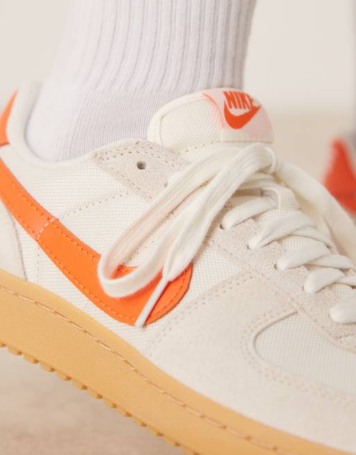 Nike Field General sneakers in off white and orange