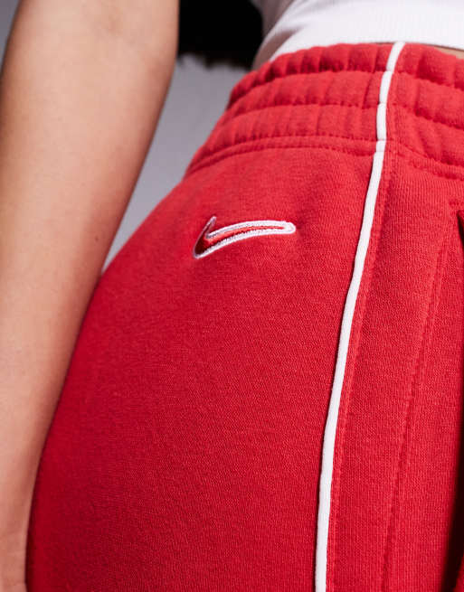 Nike fleece medium rise joggers in red ASOS