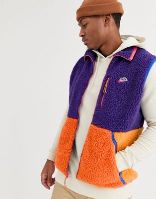 Nike - Fleece wintergilet in paars met oranje