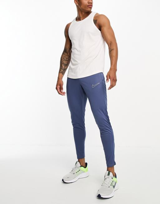 Nike Football Academy 23 track pants in blue ASOS