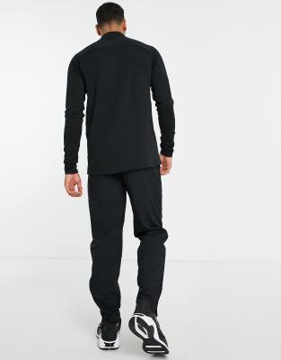 Nike Football Academy drill top in black and orange ASOS