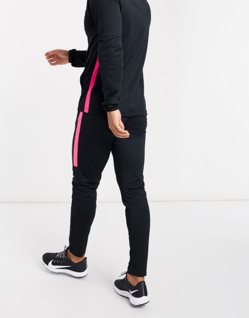 Black and clearance pink nike tracksuit