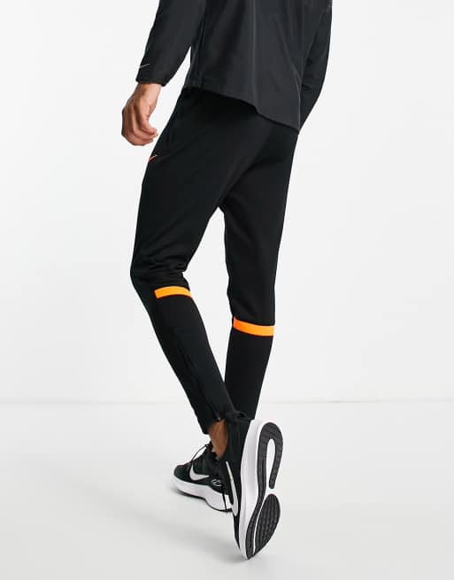 Black and 2025 orange nike sweatpants