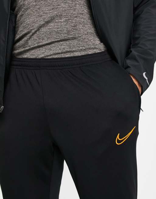 Black and orange sales nike joggers