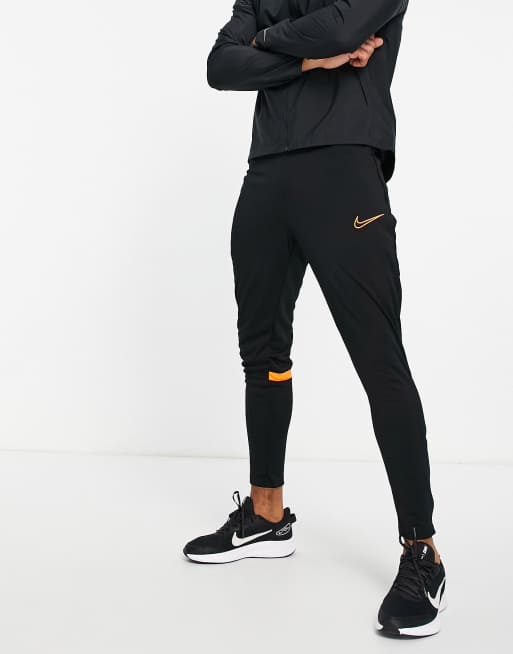 Black and 2025 orange nike sweatpants