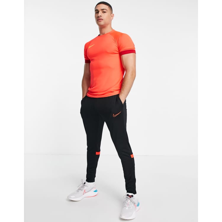 Nike Football Dri FIT Academy 21 joggers in black and red ASOS