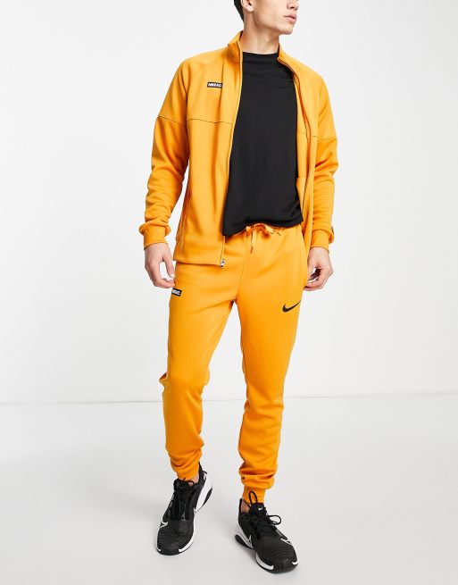 Yellow store tracksuit nike