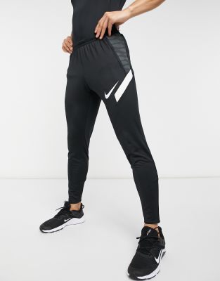 nike football strike tapered joggers in black