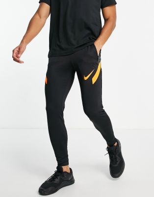 Nike Football Strike joggers in black and orange