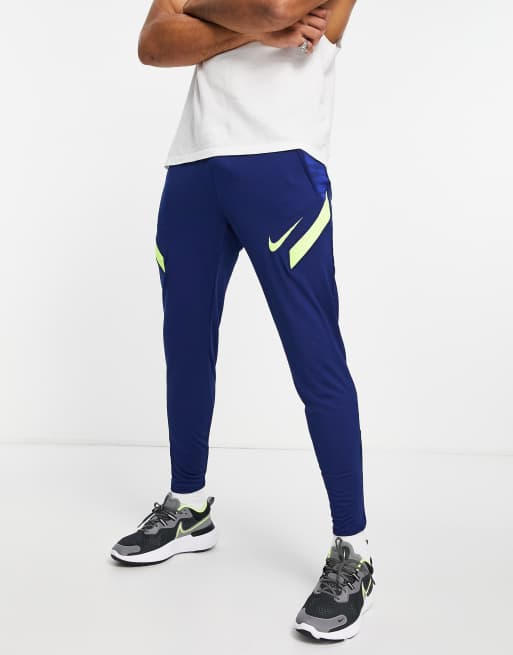 Nike Football Strike joggers in navy and volt ASOS