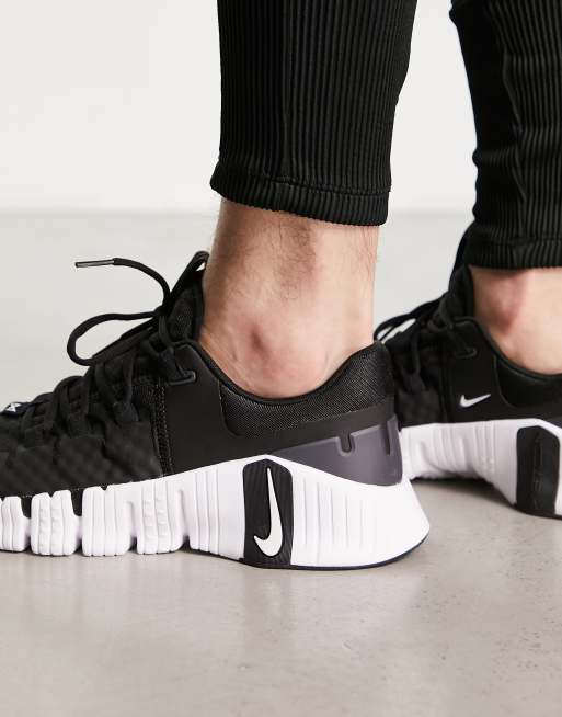 Nike Free Metcon 5 sneakers in black and white