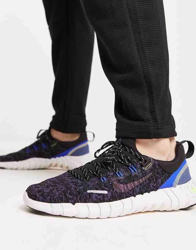 Nike Free Run 5.0 sneakers in black and blue