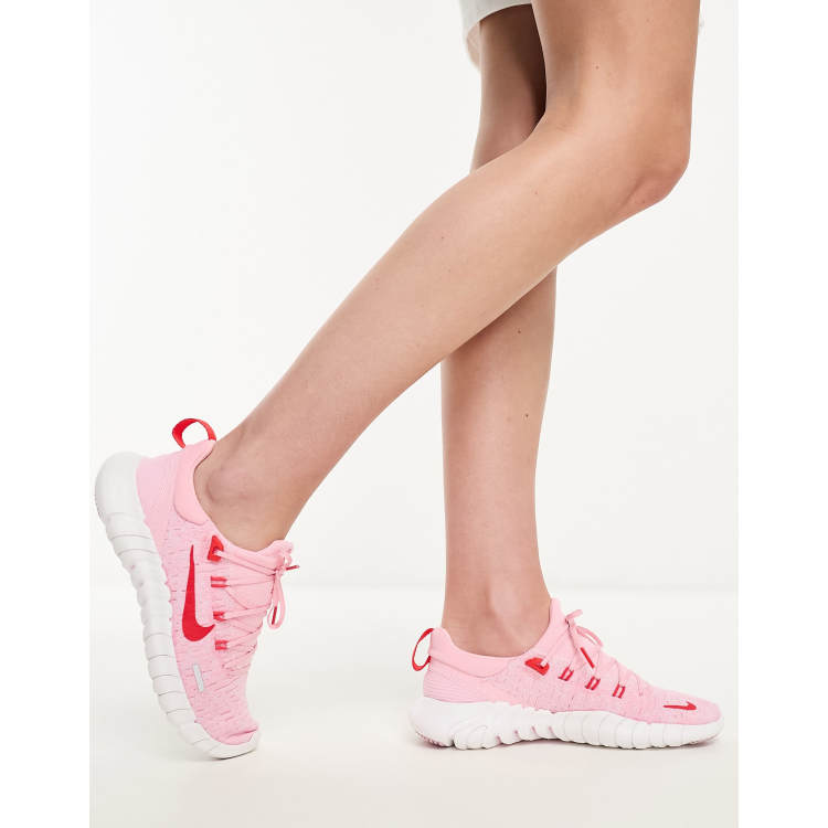 Pink nike free deals run