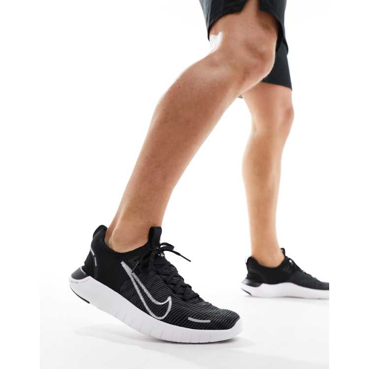 Nike Free Run Flyknit sneakers in black and white ASOS